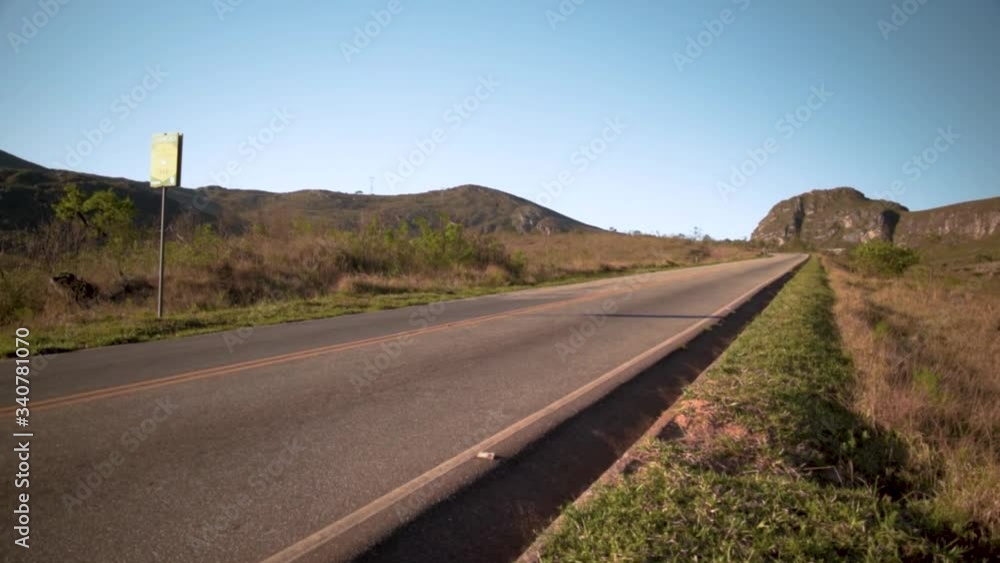 Truck passing by a calm road Truck passing by a calm road