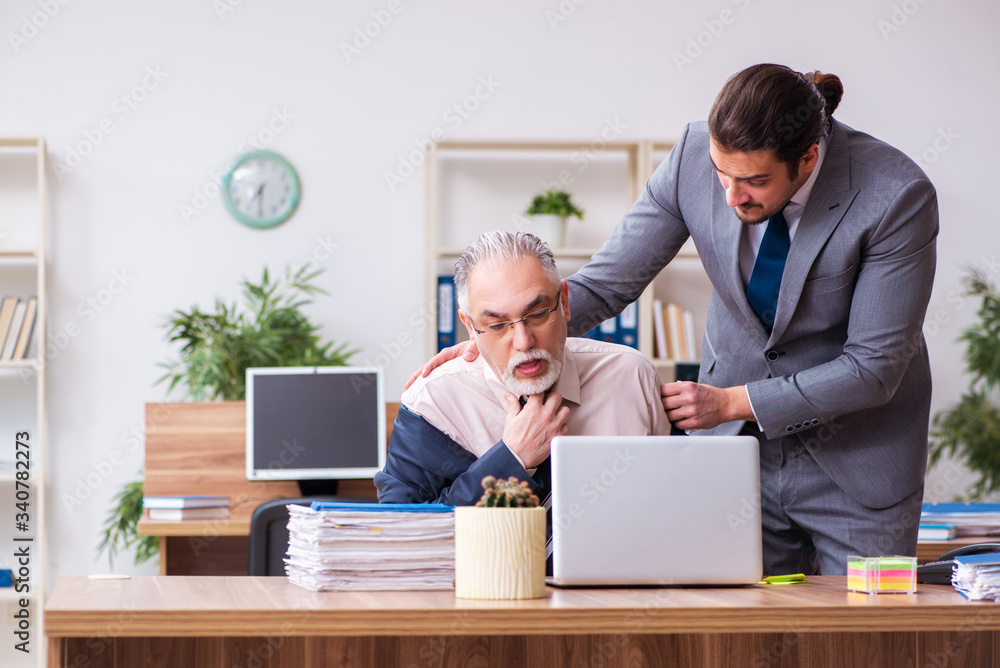 Two employees in pandemic concept at workplace Two employees in pandemic concept at workplace