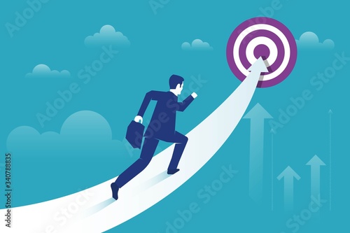 Businessman running towards goal