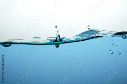 Fototapeta Naklejka Na Ścianę i Meble -  Wave and air bubbles on surface of water