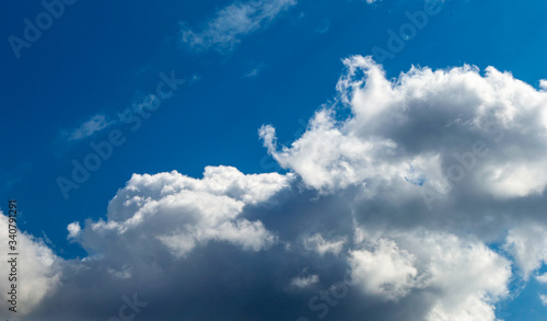 White Cumulus clouds in a bright blue 