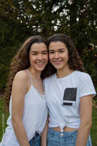 Portrait of a twin teenage sisters.