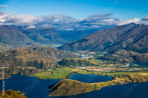 New Zealand landscape background. Roys peak mountain hike in Wanaka New Zealand. Popular tourism travel destination. Hiking travel and adventure. 
