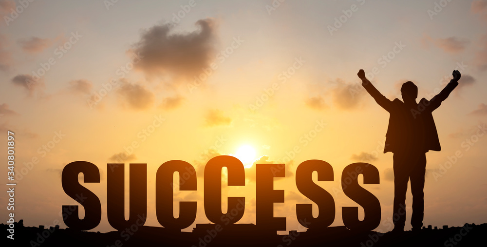 Silhouette sunset background. A man stood beside the words of success. Photo Silhouette and success concept idea.