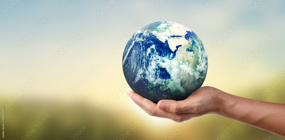 Globe ,earth in hand, holding our planet glowing. Earth image provided by Nasa Globe ,earth in hand, holding our planet glowing. Earth image provided by Nasa