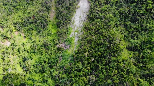 Aerial, pull back, drone shot away from a landslide in the mountains of Cayey, sunny day, in Puerto Rico, USA photo