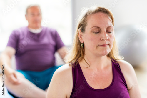 People sitting in a yoga pose