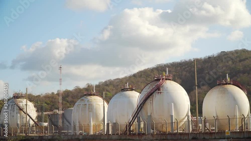 Footage B Roll of storage tank industry oil refinery gas factory plant at beautiful sky and clouds moving. Gas tank in refinery factory industrial. footage 4k. zoom in dolly. photo