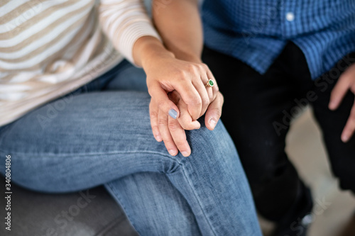 Couple holding hands in therapy