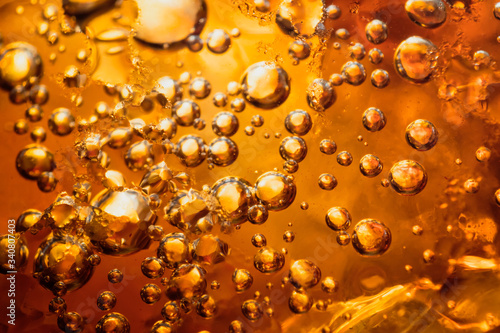 abstract water with bubbles soars over a golden background