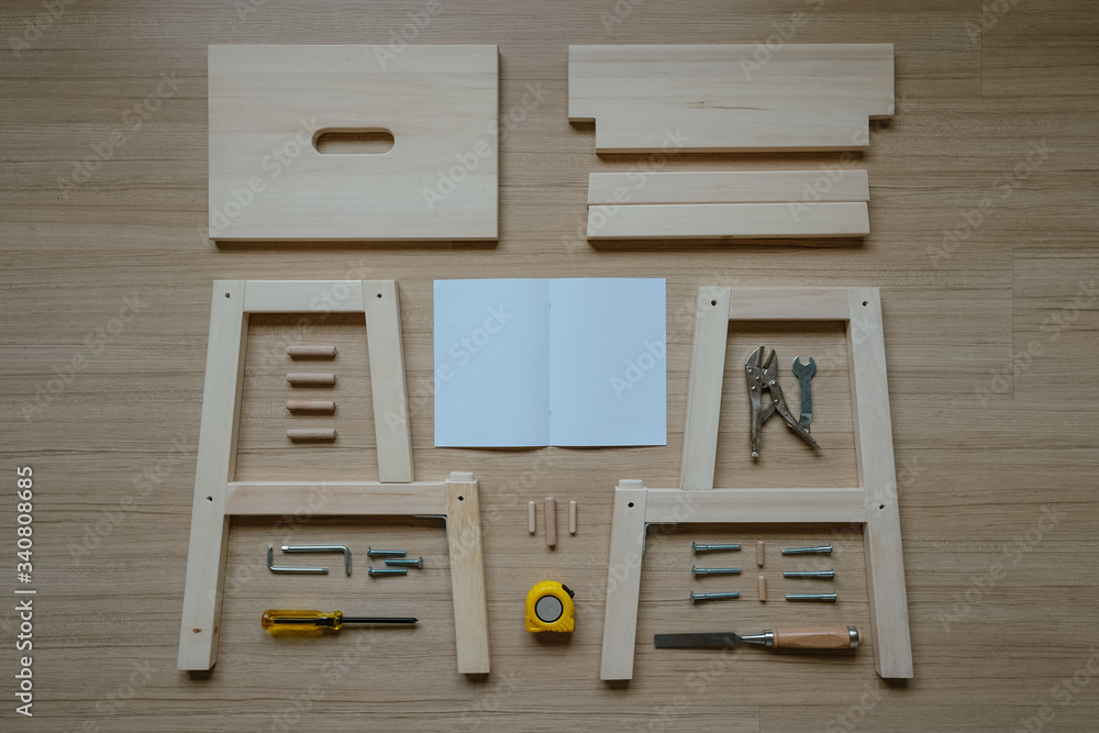 Top view of furniture assembly parts and tools on wooden floor for DIY do  it yourself and assemble the work, blank space instruction paper to put  logo Stock Photo | Adobe Stock