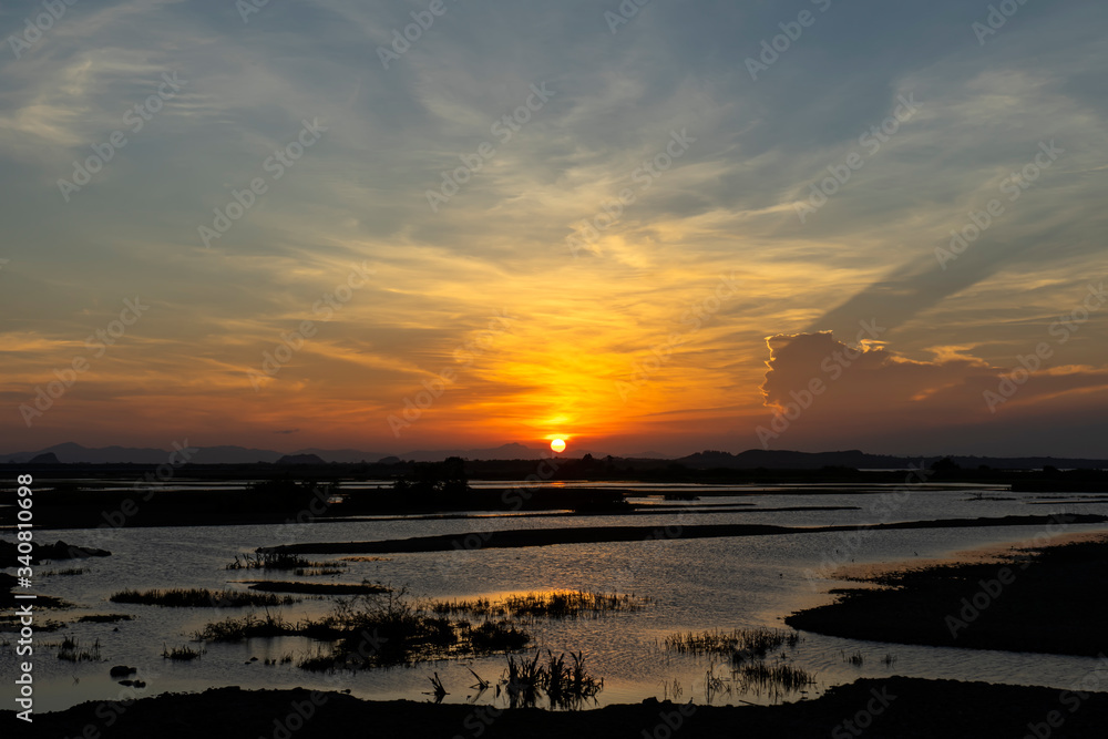Sunset sky and soft cloud above the wetland