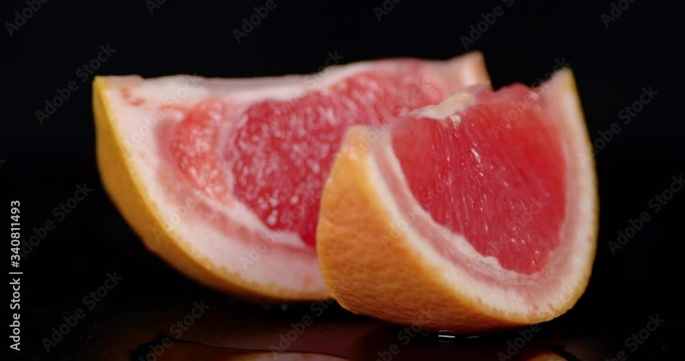 Juicy pieces of grapefruit slowly rotate. Juicy pieces of grapefruit slowly rotate.