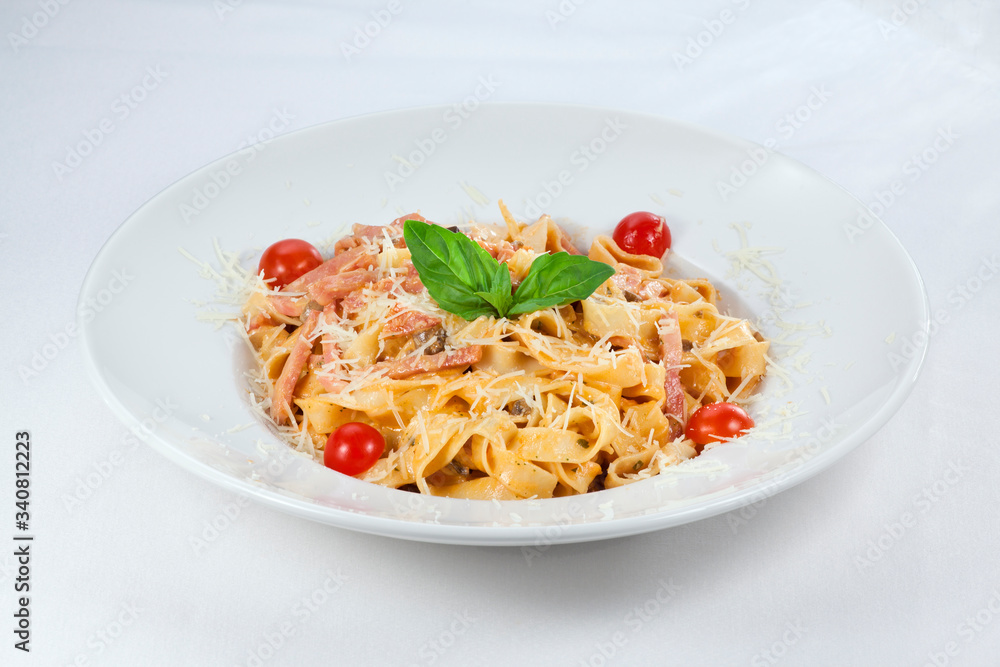 pasta with cheese and tomatoes on a white background