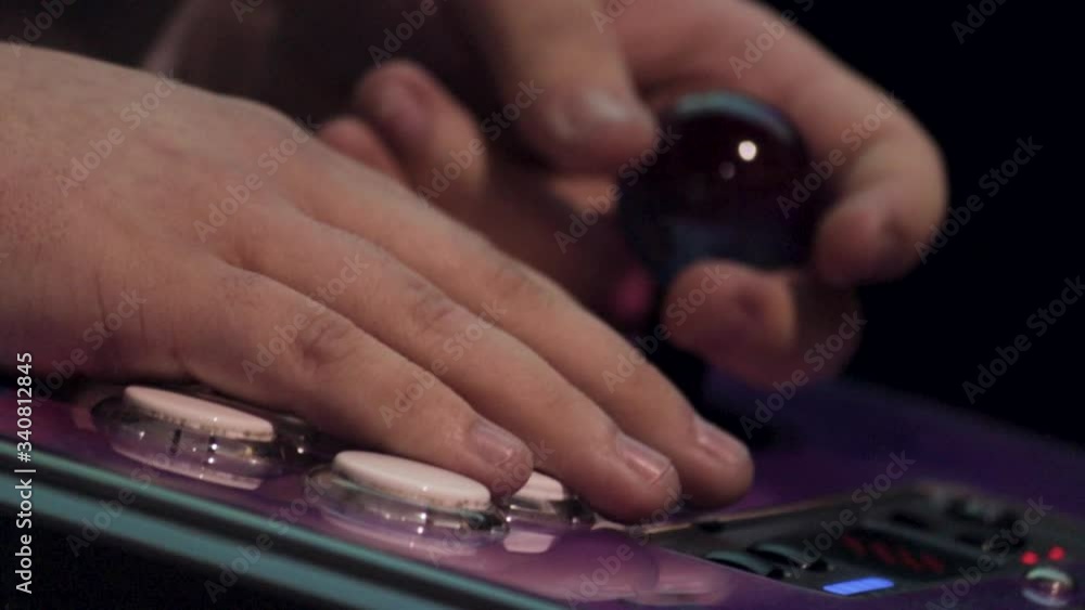 Purple gamepad being used during gaming competition, close up Purple gamepad being used during gaming competition, close up