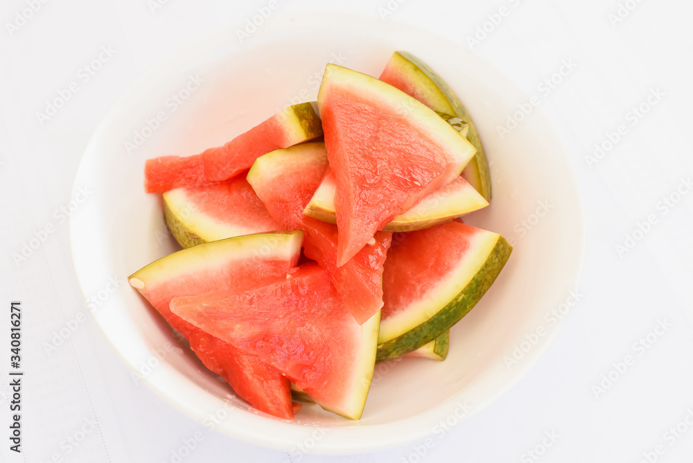 Mediterranean marinated watermelon on isolated white background, special food delivery restaurant menu, take out order, white bowl plate, sliced Mediterranean marinated watermelon on isolated white background, special food delivery restaurant menu, take out order, white bowl plate, sliced