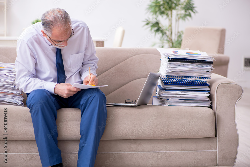 Aged businessman employee working from house Aged businessman employee working from house
