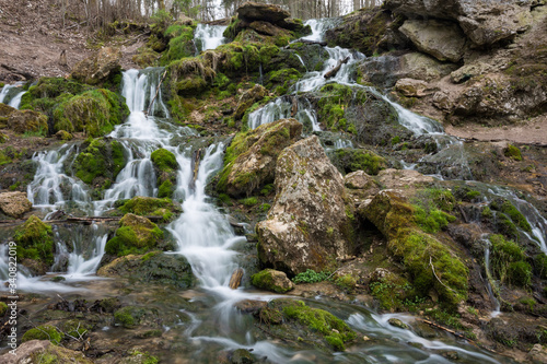 City Cesis  Latvia. Old waterfall with green moss and dolomite rocks.