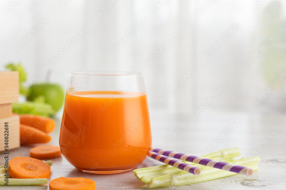 Glass with carrot juice and celery. The concept of a healthy diet or weight loss. Glass with carrot juice and celery. The concept of a healthy diet or weight loss.