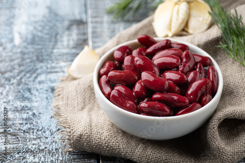 Canned red kidney beans in white bowl on a table