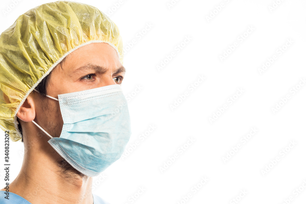doctor in medical clothes with rubber gloves and a mask, portrait on a white background doctor in medical clothes with rubber gloves and a mask, portrait on a white background