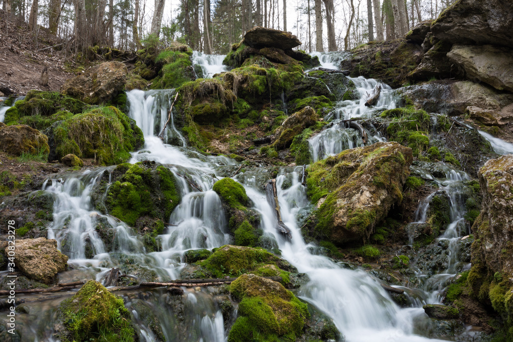 City Cesis, Latvia. Old waterfall with green moss and dolomite rocks. City Cesis, Latvia. Old waterfall with green moss and dolomite rocks.