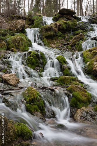 Fototapeta Naklejka Na Ścianę i Meble -  City Cesis, Latvia. Old waterfall with green moss and dolomite rocks.