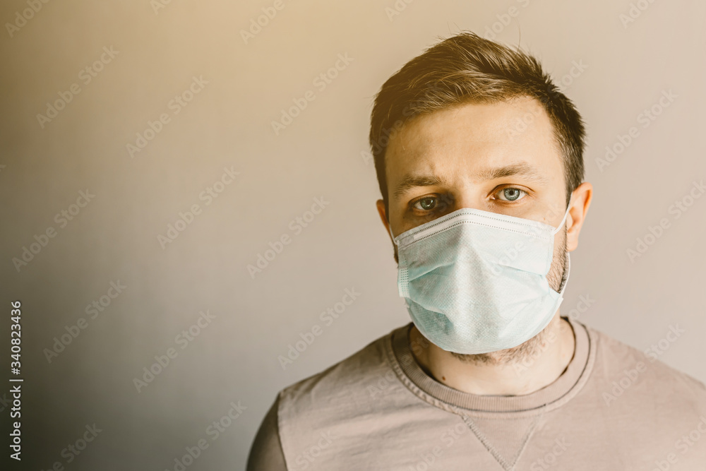 Close-up of a man in a medical mask. Self isolation. Close-up of a man in a medical mask. Self isolation.
