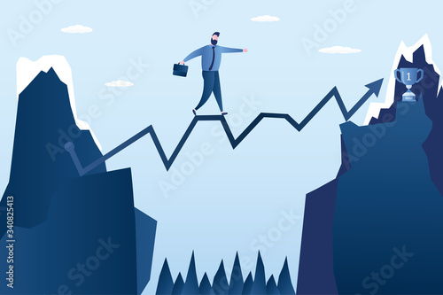 Handsome businessman walks the rope over abyss. Chart between the cliffs. Business risk management