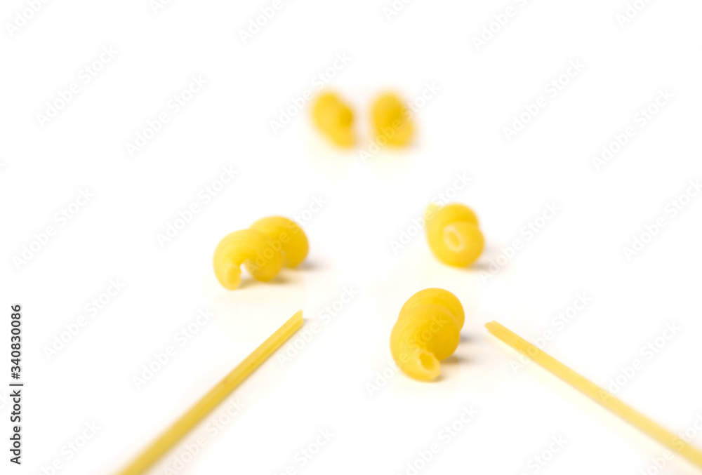 macaroni and spaghetti in macro isolated white macaroni and spaghetti in macro isolated white