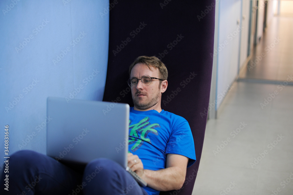 Caucasian man using computer laptop Caucasian man using computer laptop