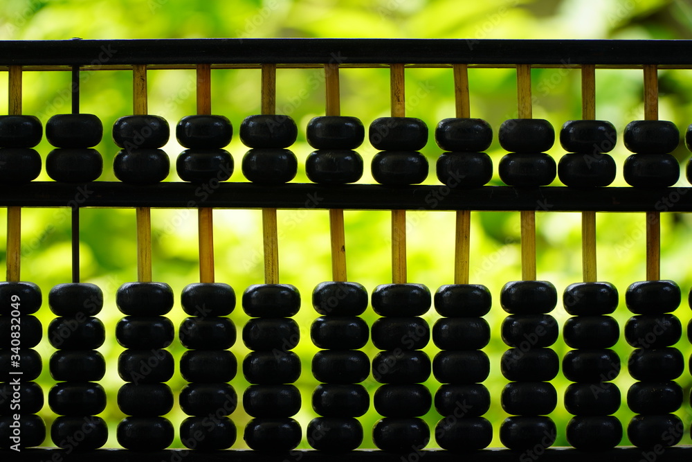 old abacus and hold electronic calculator, picture financial concept design,nature background old abacus and hold electronic calculator, picture financial concept design,nature background