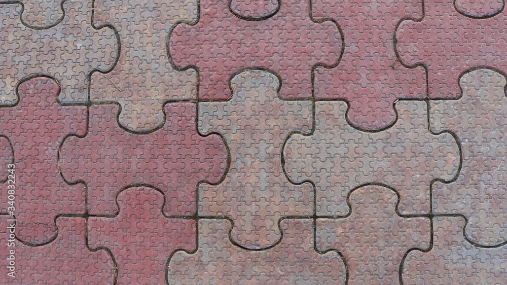 street tiles in the shape of puzzle pieces where a large part consists of small parts street tiles in the shape of puzzle pieces where a large part consists of small parts