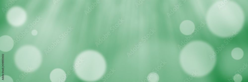 Φωτογραφία Abstract green bokeh banner background - birthday, father's day, valentine's day panorama - blurry bokeh circles on a green background