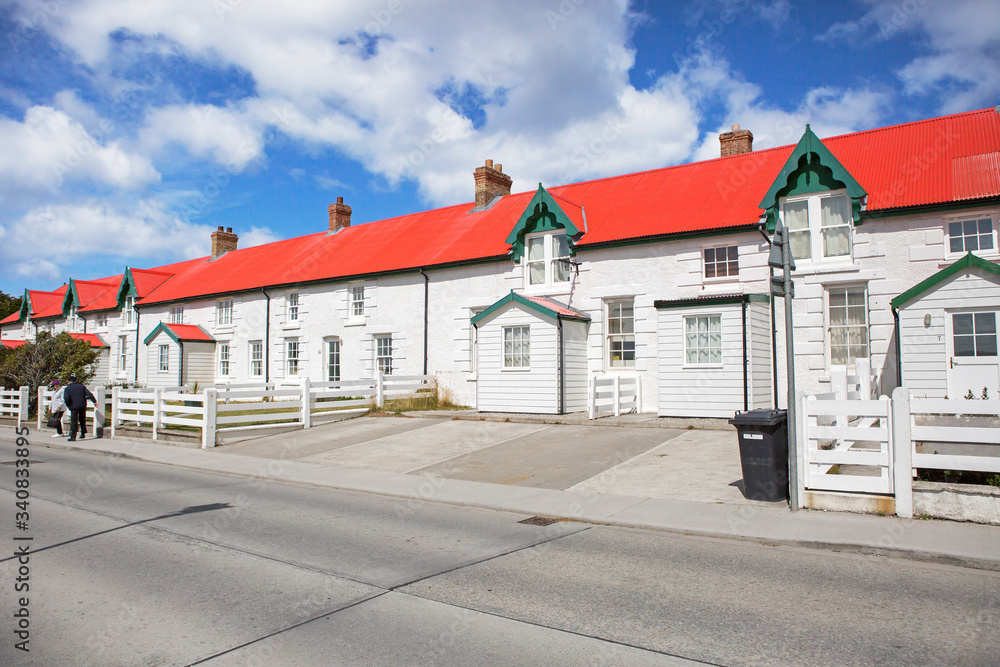 Port Stanley, Falkland Islands, cityscape.
 Almost all the houses in the city are made of wood. In front of the house there are manicured lawns.