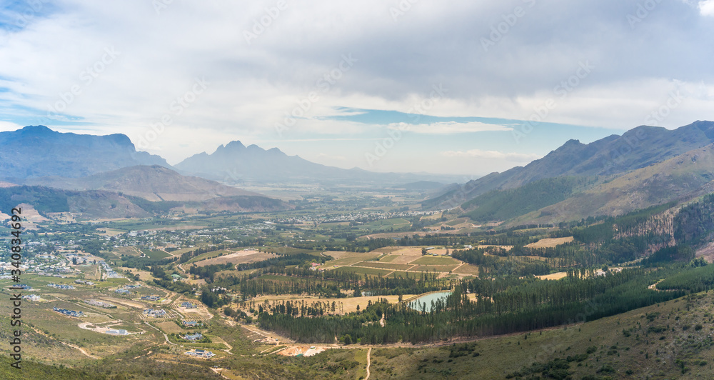 Epic mountain valley landscape with rural town