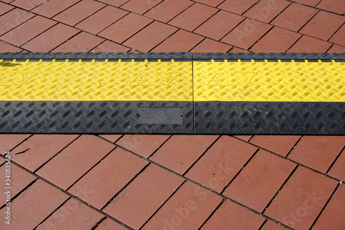 Safety rubber cable protection cover for scene or outdoor events.