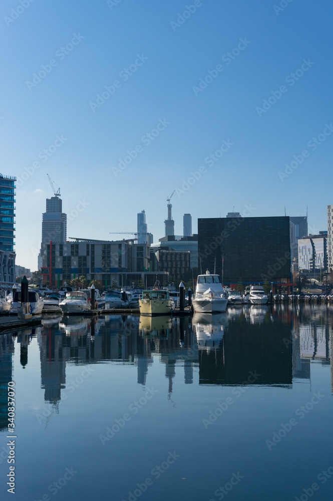 Docklands cityscape with marina, yachts and skyscrapers