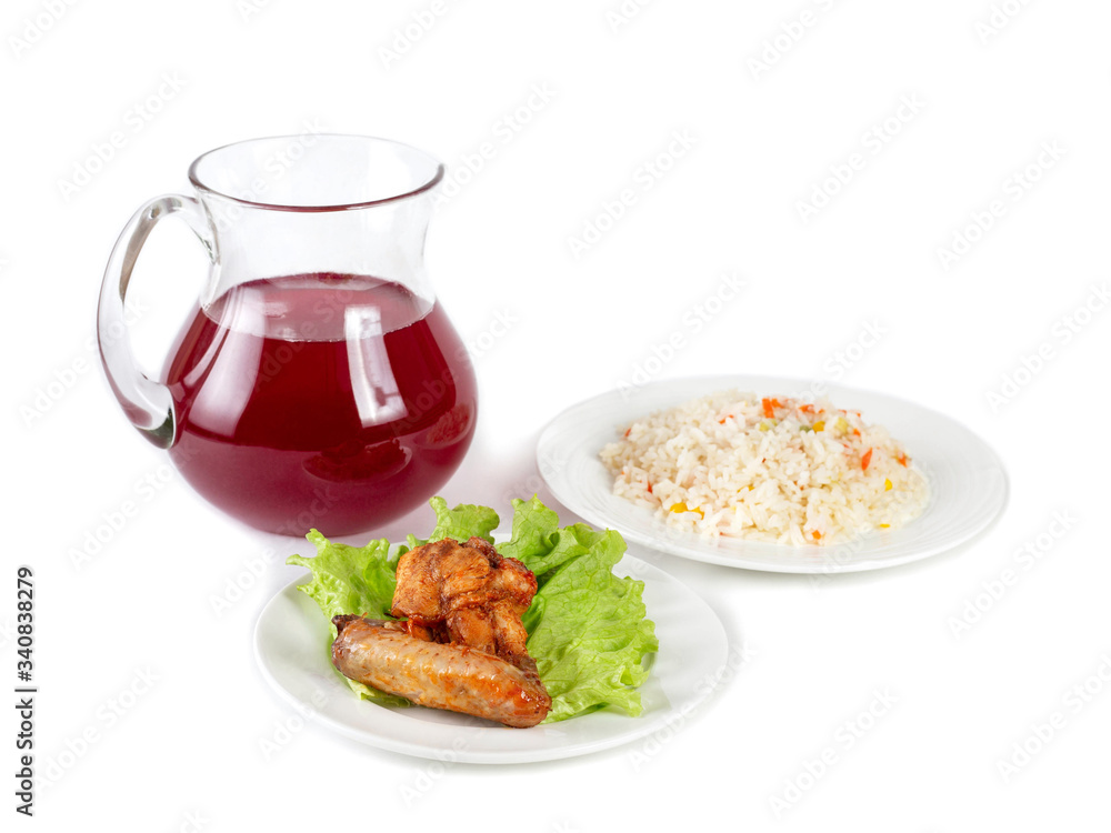 Light lunch, a slice of fried chicken, rice with fruits and a jug of berry drink on a white background
