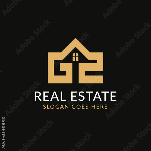 Creative real estate GZ letter logo design. House  Property development  construction and building icon template. Isolated in dark background with gold color. Minimalist home vector in eps 10.