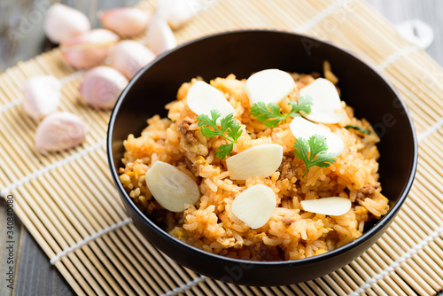 Fried rice with minced pork and sliced garlic in a bowl, Asian food