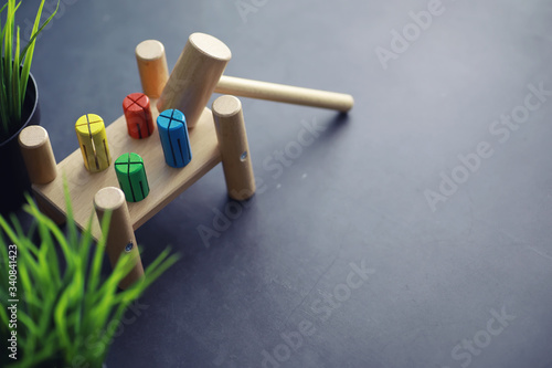 Children's development. Children's wooden toy on the table in the play area. Room of children's creativity and self-development. Wooden constructor.