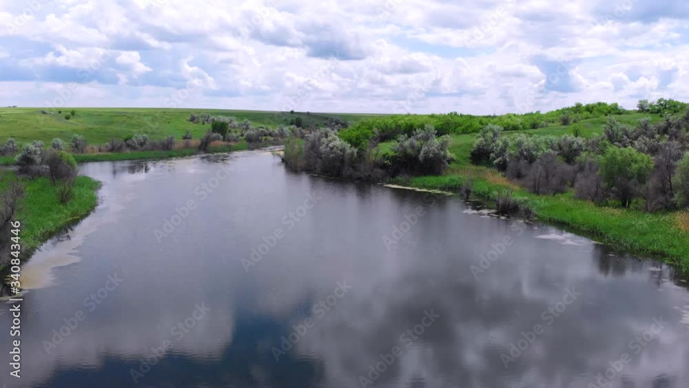 Ukraine. Spring. River. Drone. Aerial view. Flight over the water surface. The camera moves forward Ukraine. Spring. River. Drone. Aerial view. Flight over the water surface. The camera moves forward