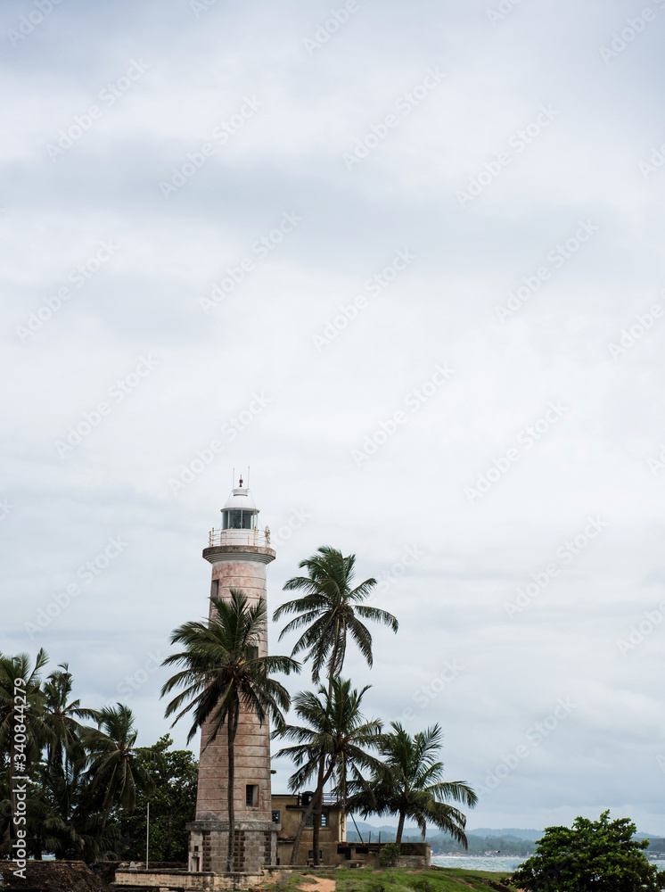view of the lighthouse with palm trees against the sky in asia view of the lighthouse with palm trees against the sky in asia