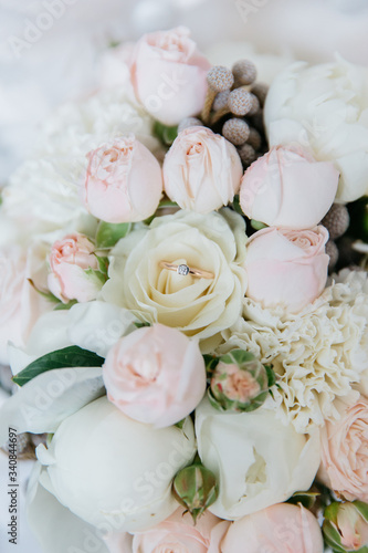 wedding delicate pink bouquet with a ring inside closeup
