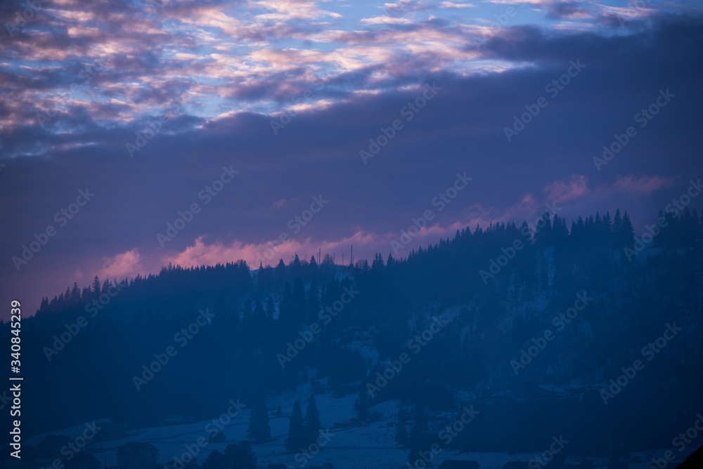 beautiful blue sky with clouds at sunset in the mountains