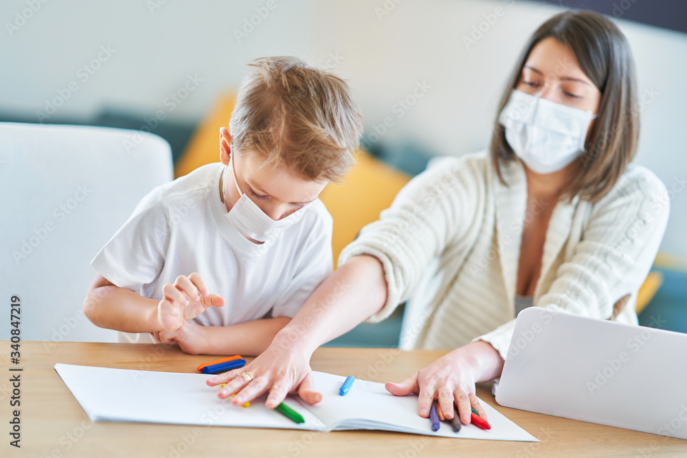 Boy and exhausted mother trying to work at home during coronavirus pandemic Boy and exhausted mother trying to work at home during coronavirus pandemic