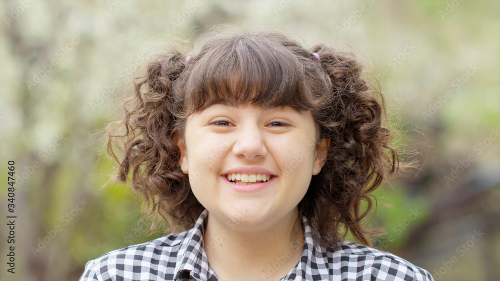 Standing alone in outdoor Little girl looking at camera and having fun, smiling, emotions. Close Up Face photo Red camera still. Happy girl portrait. Standing alone in outdoor Little girl looking at camera and having fun, smiling, emotions. Close Up Face photo Red camera still. Happy girl portrait.