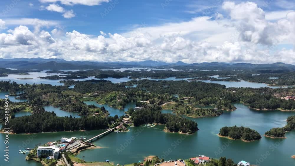 View of the Peñol reservoir from El Peñón de Guatapé. Tilt down shot