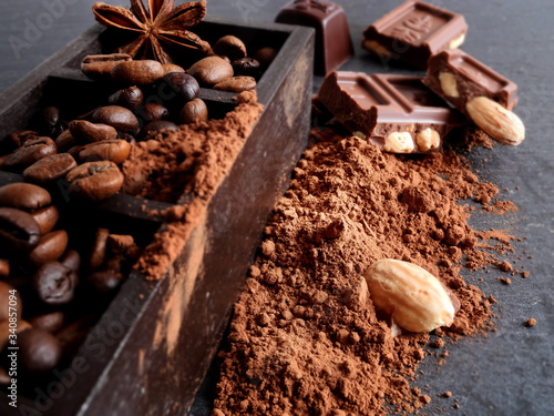coffee beans, anise star, chocolate, nuts and cocoa powder, spices
